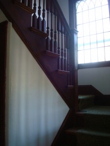 Front staircase that reminds me of being in church every time I use it